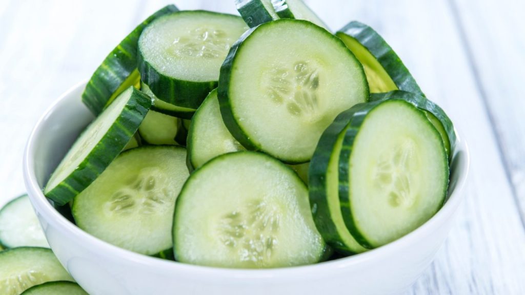 Cucumber slices in a white ceramic bowl