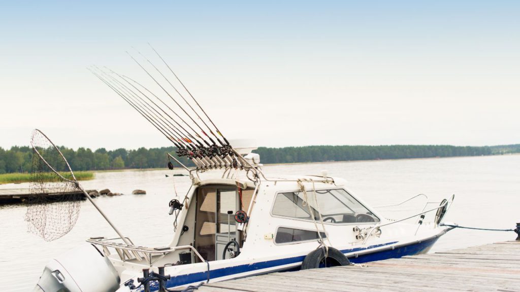Photo of a trolling boat with multiple rods attached at the roof